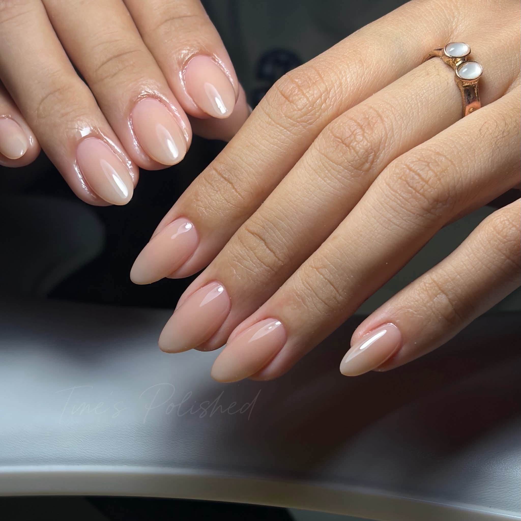 Glossy nude almond nails