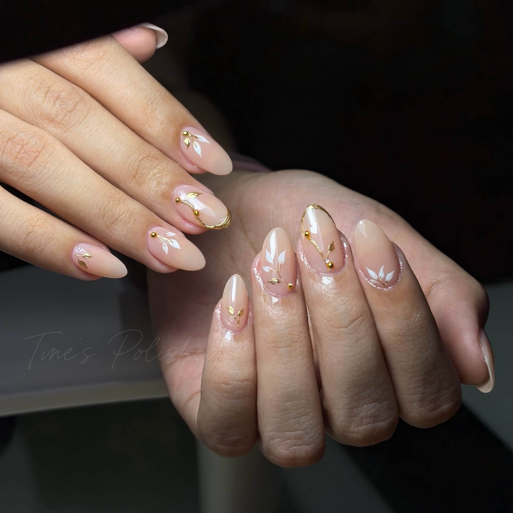 Nude floral and gold nail art