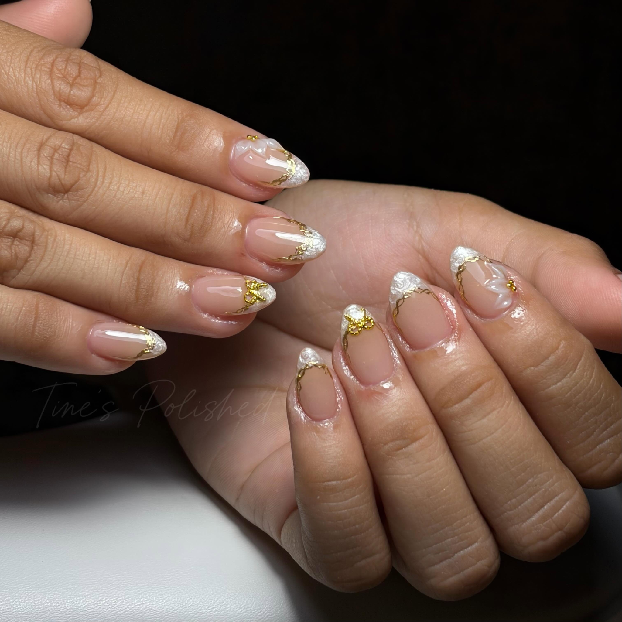 White and gold detailed nails